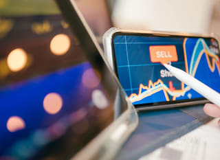 Analyst examining forex options alongside Bitcoin and Ethereum across multiple markets