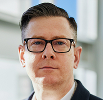 Alexander Hughes, chief executive officer of a crypto trading company, executive portrait